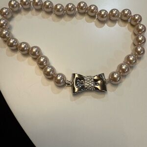Elegant Pearl Necklace with Silver Bow Clasp